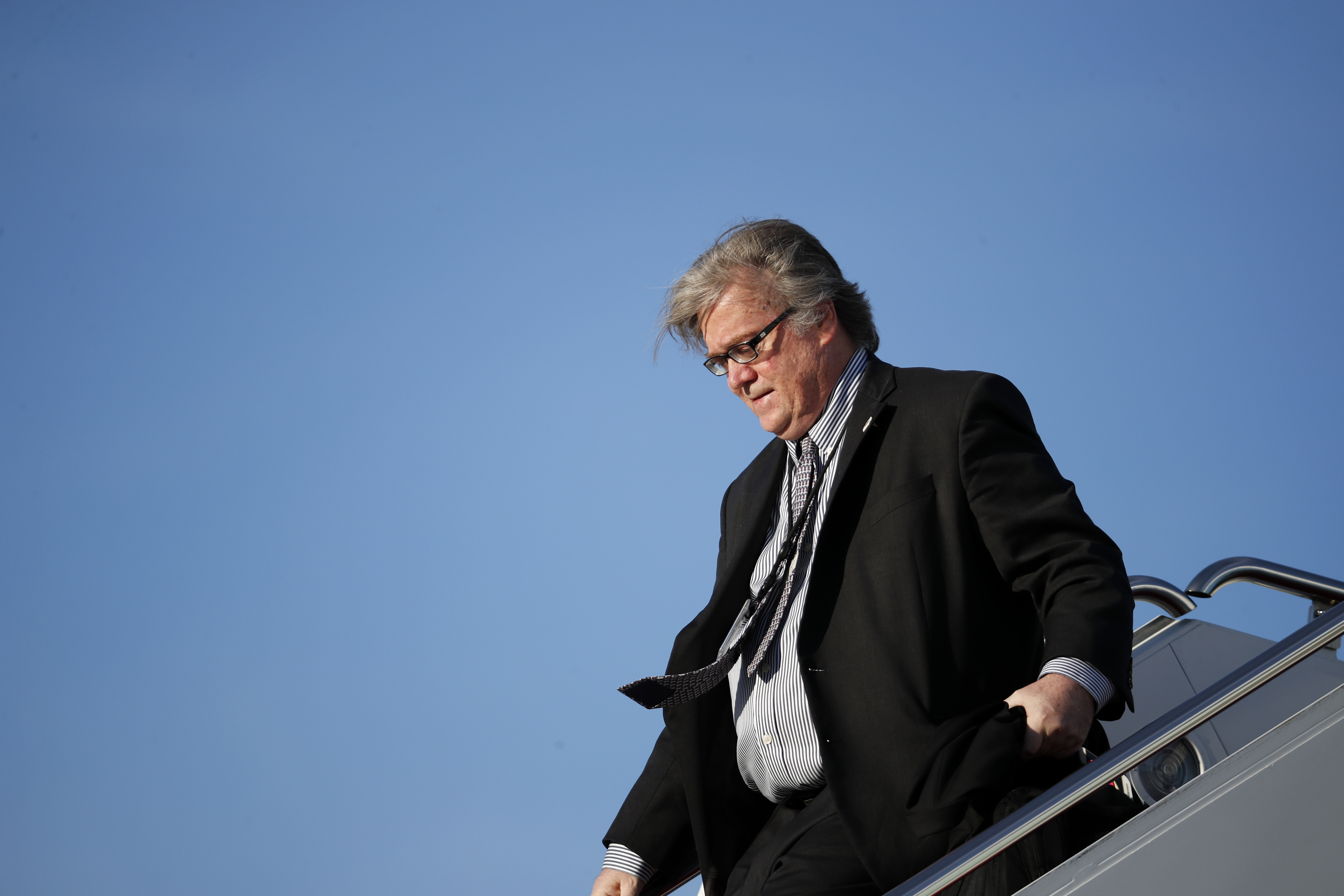 Former White House chief strategist Steve Bannon steps off Air Force One