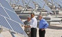 Flanked by Senate Majority Leader Harry Reid, D-Nev., and Col. Howard Belote, Obama examined solar energy at Las Vegas' Nellis Air Force Base in 2009.
