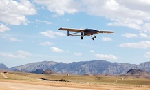 A TigerShark unmanned aerial vehicle descends to land at an undisclosed location following a mission. 