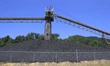 Coal lies in piles around a conveyor system at a Kentucky mine.