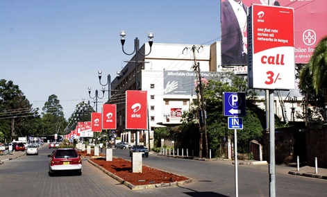 Nairobi streets are adorned with mobile phone ads.