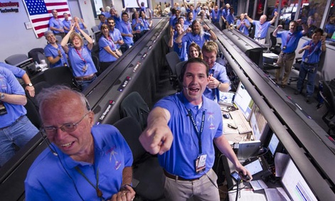 NASA/JPL ground controllers react to learning the Curiosity rover had landed safely on Mars.