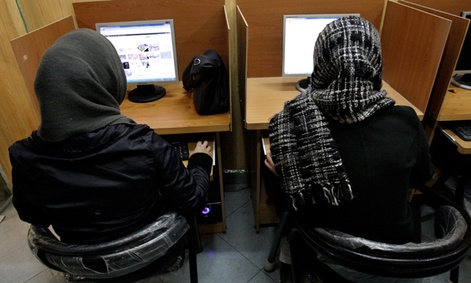 Iranian women use computers at an Internet cafe in central Tehran, Iran.