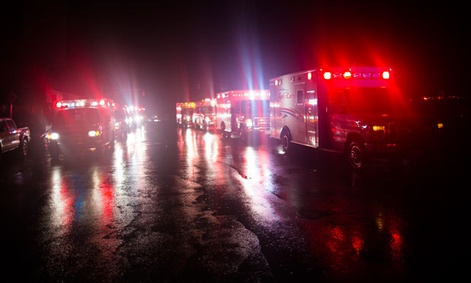 Ambulances wait outside New York University Tisch Hospital during the storm.