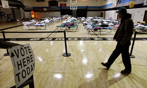 A person walks through a makeshift shelter in Tom's River, NJ as they arrive to vote.