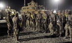 U.S. soldiers from the 4th Brigade, 82nd Airborne arrive to a yard where they will turn in their vehicles and equipment as part of drawdown of 23,000 U.S. troops at the Kandahar Air Field south of Kabul, Afghanistan. U.S. soldiers from the 4th Brigade, 82nd Airborne arrive to a yard where they will turn in their vehicles and equipment as part of drawdown of 23,000 U.S. troops at the Kandahar Air Field south of Kabul, Afghanistan.