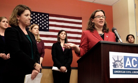 American Civil Liberties Union Women's Rights Project senior staff attorney Ariela Migdal speaks with several active female military personnel who have filed a federal lawsuit demanding combat action. American Civil Liberties Union Women's Rights Project senior staff attorney Ariela Migdal speaks with several active female military personnel who have filed a federal lawsuit demanding combat action.