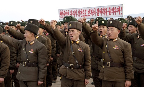 In this Nov. 23, 2012 photo, North Korean soldiers vow to retaliate against any South Korean military action during a rally in South Hwanghae Province.