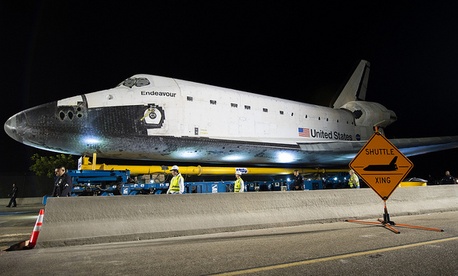 The space shuttle Endeavour is seen atop the Over Land Transporter (OLT) after exiting the Los Angeles International Airport on its way to its new home at the California Science Center in Los Angeles, Friday, Oct. 12, 2012. The space shuttle Endeavour is seen atop the Over Land Transporter (OLT) after exiting the Los Angeles International Airport on its way to its new home at the California Science Center in Los Angeles, Friday, Oct. 12, 2012.