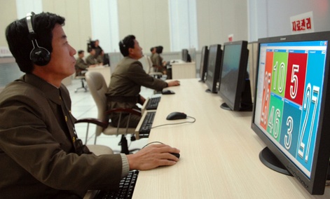 Scientists and technicians work on their computers to control the launch of North Korea's Unha-3 rocket  in Pyongyang, North Korea on Dec. 12, 2012.