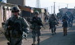 Soldiers conduct foot patrols in Kabul in 2009.