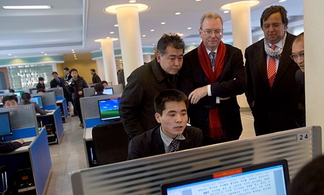 Executive Chairman of Google, Eric Schmidt, third from left, and former New Mexico governor Bill Richardson, second from right, watch as a North Korean student surfs the Internet.