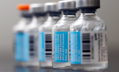 Vials of flu vaccine are displayed