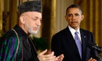President Barack Obama listens to Afgan President Hamid Karzai 