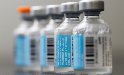 Vials of flu vaccine are displayed at Philly Flu Shots in Philadelphia.