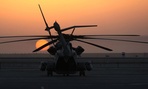 The sun rises over a CH-53E Super Stallion in Afghanistan in 2010