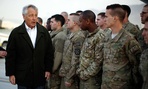 U.S. Secretary of Defense Chuck Hagel greets U.S. Army troops on the tarmac of Kabul airport in Afghanistan.