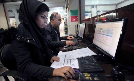 Iranians surf the web in an internet cafe at a shopping center, in central Tehran, Iran.