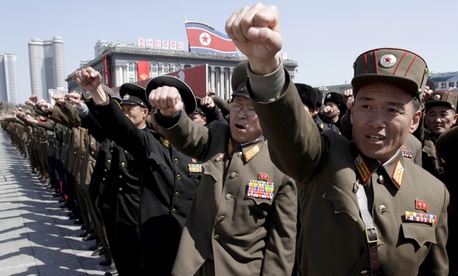 North Korean army officers punch the air as they chant slogans during a rally at Kim Il Sung Square in downtown Pyongyang. North Korean army officers punch the air as they chant slogans during a rally at Kim Il Sung Square in downtown Pyongyang.
