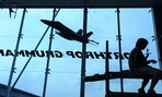 A contractor is silhouetted at the Singapore Airshow in 2009. Northrop Grumman is a top federal contractor. 