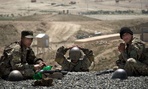 Afghan Army soldiers rest between training sessions at a military training facility on the outskirts of Kabul, Afghanistan. 