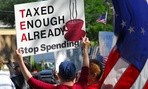 A protestor holds a sign at a Tea Party rally in Florida. A protestor holds a sign at a Tea Party rally in Florida.