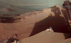 Mars Rover Opportunity catches its own late-afternoon shadow in a view eastward across Endeavour Crater on Mars.
