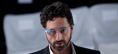 Google co-founder Sergey Brin dons a pair of Google Glasses