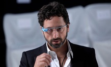 Google co-founder Sergey Brin dons a pair of Google Glasses
