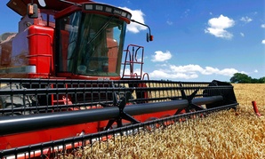 Illinois farmer Jacob Hermes uses a combine to harvest his winter wheat crop.
