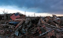 A flag blows in rubble in Oklahoma Tuesday.