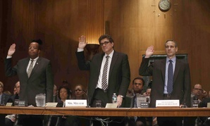TIGTA J. Russell George, former Acting IRS Commissioner Steven Miller, and former IRS Commissioner Douglas Shulman give oaths before testifying in front of the Senate Finance Committee