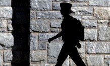 A female cadet walks on campus at the United States Military Academy at West Point, N.Y.