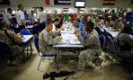 Service members eat lunch inside the chow hall at Kandahar Airfield, Afghanistan. Service members eat lunch inside the chow hall at Kandahar Airfield, Afghanistan.