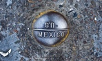 A sign marks the border near San Ysidro, California.