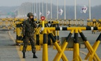 A South Korean soldier uses his radio at Unification Bridge. A South Korean soldier uses his radio at Unification Bridge.