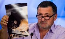 Abdul-Baki Todashev holds a photo he claims is of his dead son Ibragim Todashev.