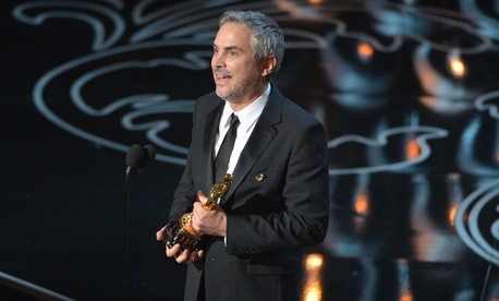 Director Alfonso Cuarón won for directing Gravity's story of NASA astronauts caught in space. Director Alfonso Cuarón won for directing Gravity's story of NASA astronauts caught in space.