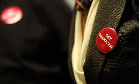 Associates at Community Health Center wear buttons reading "Get Obamacare" in October. Associates at Community Health Center wear buttons reading "Get Obamacare" in October.