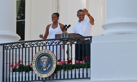 The Obamas greet military families as they host an Independence Day celebration Friday. The Obamas greet military families as they host an Independence Day celebration Friday.
