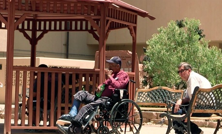 Men sit outside the Raymond G. Murphy VA Medical Center in Albuquerque, N.M., Thursday, July 3, 2014. Men sit outside the Raymond G. Murphy VA Medical Center in Albuquerque, N.M., Thursday, July 3, 2014.