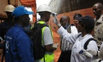 A team from CDC observes health screening at the Conakry Maritime Port in Guinea.