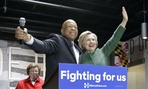 Hillary Clinton embraces Rep. Elijah Cummings, D-Md., at a campaign event in April. Cummings chairs the party's platform committee.