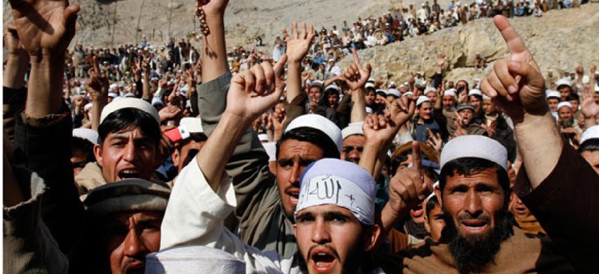 Afghans shout slogans during a protest in Ghani Khall.