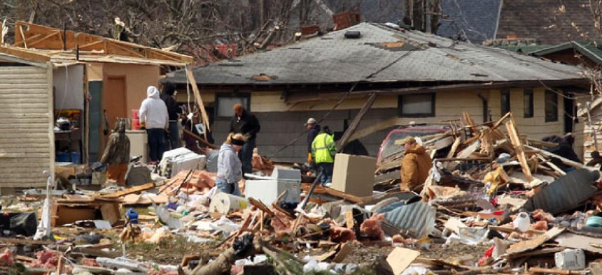 Residents assess tornado damage in Holton, Ind.