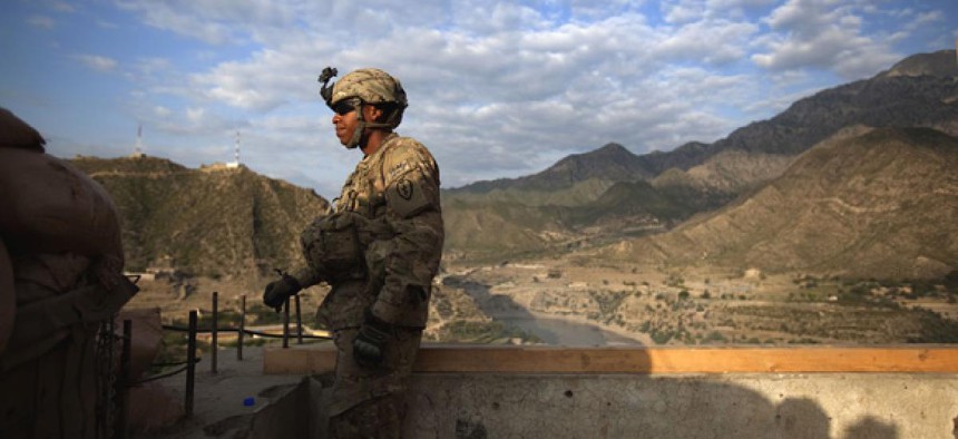 Pfc. Garrick Carlton keeps watch over an installment in Afghanistan.