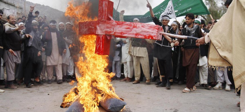 Afghans burn an effigy of Barack Obama following the killing of civilians by an Army staff sergeant.