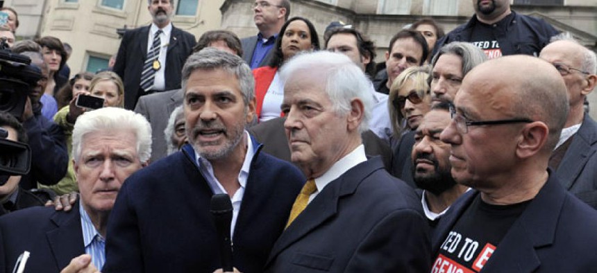  From left, Rep. Jim Moran, D-Va., actor George Clooney and journalist Nick Clooney were arrested after taking part in a protest at the Sudan Embassy in Washington 