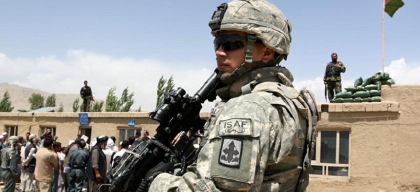 A U.S. soldier stands guard in Ghazni province, where more troops will be moved soon, according to reports.