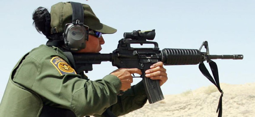 An agent practices at a U.S. Border Patrol firing range